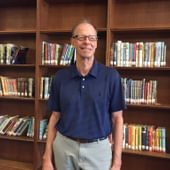 Robert Perry, white man with short gray hair and glasses.